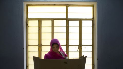A woman casts her vote on the outskirts of Jaipur, India, on Thursday, April 17.