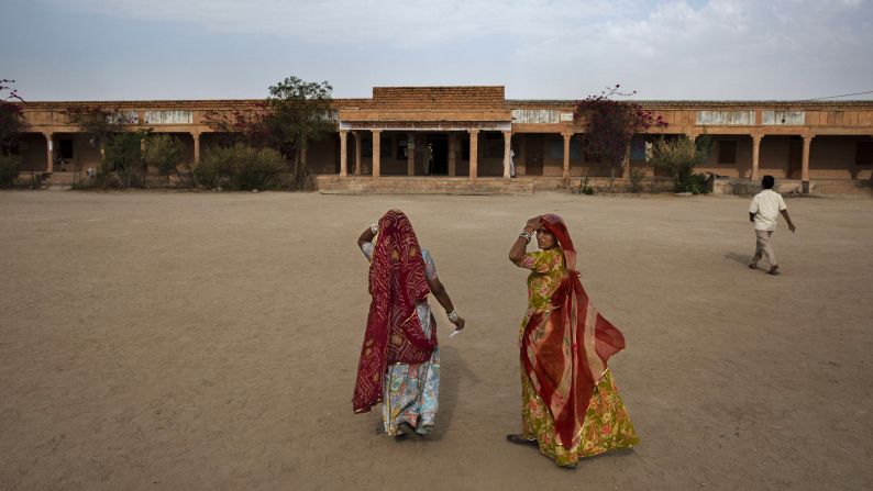 Women arrive to vote at a polling station on April 17, in the desert state of Rajasthan.