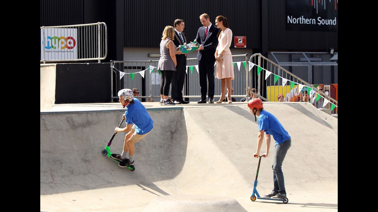 The royal couple is given a skateboard by city of Playford Mayor Glenn Docherty, second left, during a display at a skate park in the Adelaide suburb of Elizabeth on April 23. 