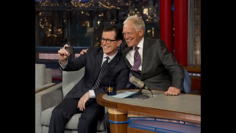 Colbert <a href="http://www.cnn.com/2014/04/23/showbiz/stephen-colbert-david-letterman-appearance/index.html?hpt=hp_c3">takes a selfie </a>with Letterman on the "Late Show with David Letterman" in April 2014. CBS began to introduce the next host of the "Late Show" by having its current host interview him.