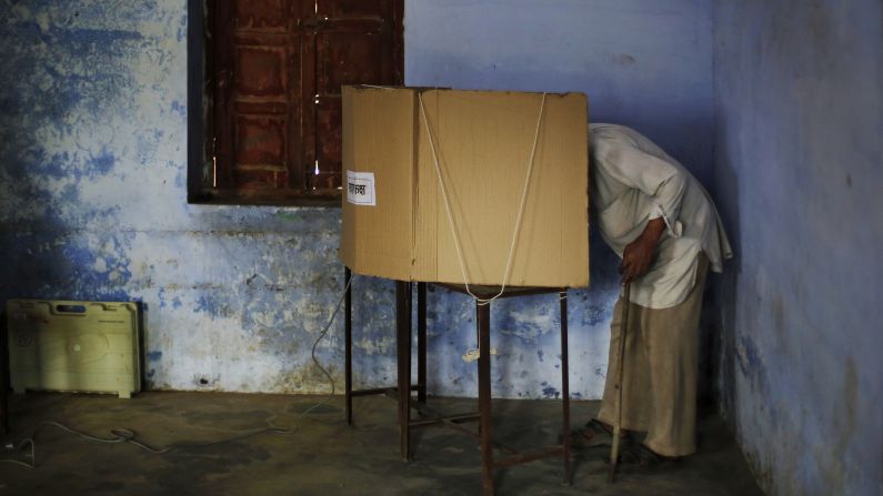 An elderly man casts his vote inside a polling station in Amroha, India, on April 17.