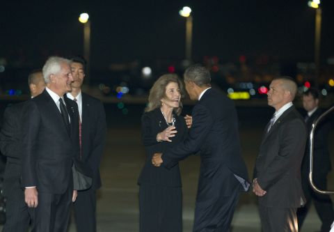 Kennedy greets Obama upon his arrival in Tokyo on April 23.