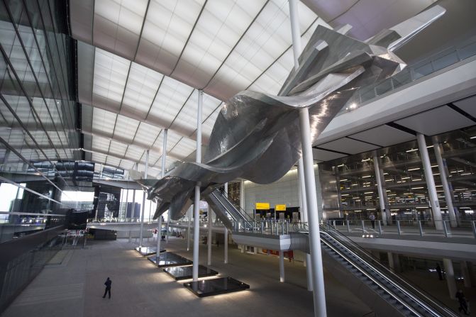 London Heathrow Airport has unveiled its new Terminal 2, otherwise known as the Queen's Terminal. Artist Richard Wilson says his "Slipstream" artwork inside the terminal's wide atrium shows Britain is the "world's cultural capital." 