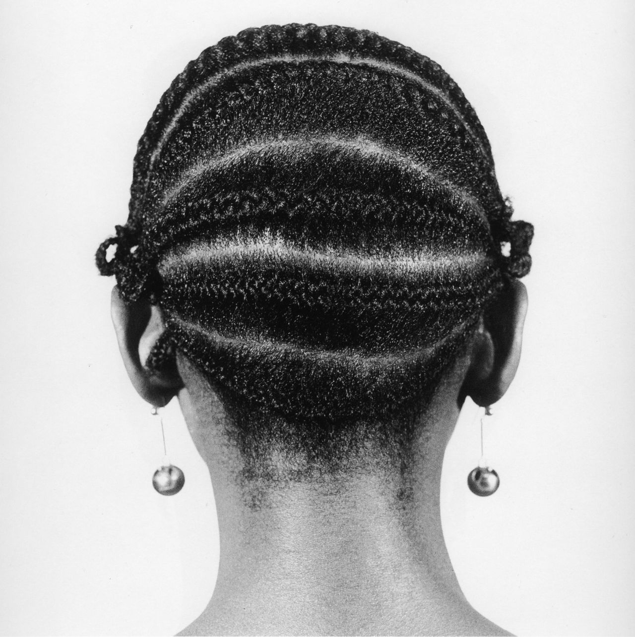 Fro Fro, 1970. Photographer J. D. 'Okhai Ojeikere popped up in offices, on the street and even at parties taking pictures of women's hairstyles, systematically shooting each style from three angles and noting down its name. 
