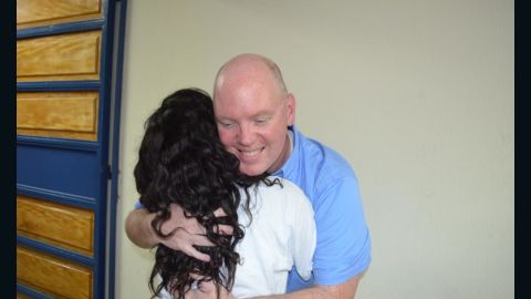 Covenant House CEO Kevin Ryan hugs a resident.