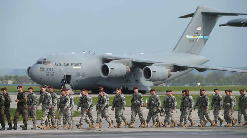 SWIDWIN, POLAND - APRIL 23:  Members of the U.S. Army 173rd Airborne Brigade disembark upon their arrival by plane at a Polish air force base on April 23, 2014 in Swidwin, Poland. Approximately 150 U.S. troops, as well as another 450 destined for the three Baltic states in coming days, will participate in bilateral military exercises over the coming weeks in a sign of commitment among NATO members. Tensions are rising in eastern Ukraine between Russian separatists and Ukrainian authorities and NATO is seeking to reassure its own members located close to Russia.  (Photo by Sean Gallup/Getty Images) *** BESTPIX ***