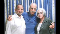 Alan Gross, center, with his wife Judy, left, and attorney Scott Gilbert in 2013.