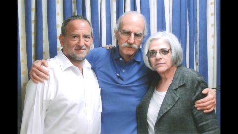 Alan Gross, center, visits with his wife, Judy, left, and attorney Scott Gilbert in 2013.