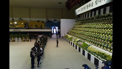 People attend a memorial for the victims at Olympic Memorial Hall in Ansan.