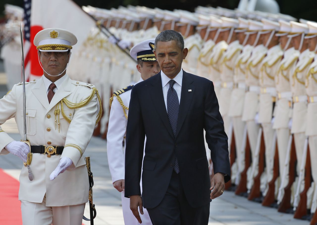 Obama reviews an honor guard during a welcoming ceremony at the Imperial Palace in Tokyo on April 24.