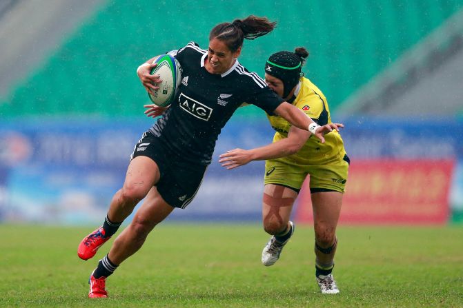 McAlister tries to evade a tackle by Emilee Cherry during New Zealand's win in April's final in China. Her opponent is the series' leading try scorer this season with 24 to McAlister's 20. 