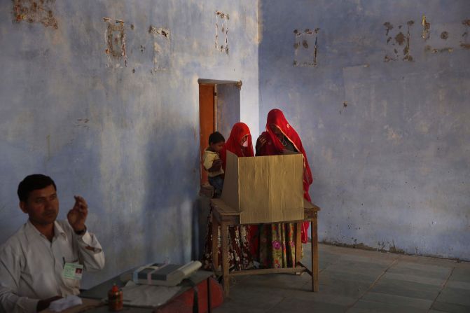 Indian women cast their vote at a village near Sawai Madhopur, India, on Thursday, April 24.