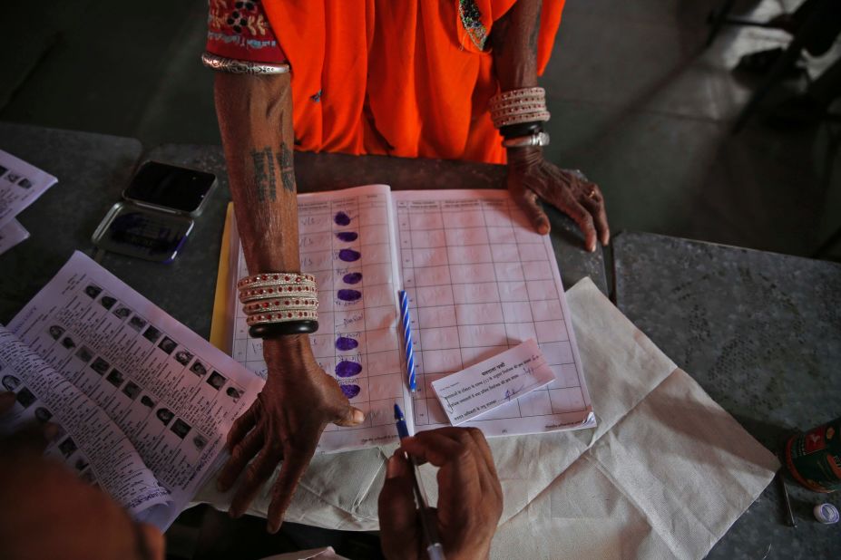 An Indian woman gives her thumb impression before casting her vote in a village near Sawai Madhopur on April 24.