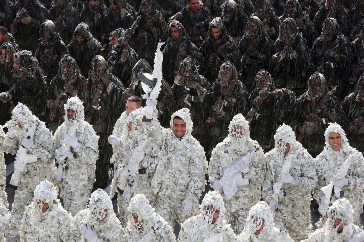 Wearing ghillie suits, Iranian army troops march in a parade marking National Army Day in front of the mausoleum of the late revolutionary founder Ayatollah Khomeini just outside Tehran on Friday, April 18.
