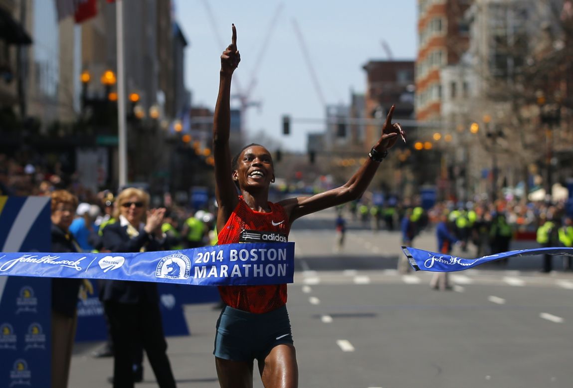 Rita Jeptoo of Kenya breaks the tape to win the women's division at the <a href="http://www.cnn.com/2014/04/21/us/boston-marathon/">118th running of the Boston Marathon</a> on Monday, April 21. For Jeptoo, 33, it was a second consecutive victory. She again won the women's division with an unofficial -- and course record -- time of 2:18:57, <a href="https://twitter.com/bostonmarathon" target="_blank" target="_blank">according to the event's official Twitter account.</a>