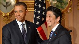 US President Barack Obama (L) shakes hands with Japanese Prime Minister Shinzo Abe following a bilateral press conference at the Akasaka Palace in Tokyo on April 24, 2014.