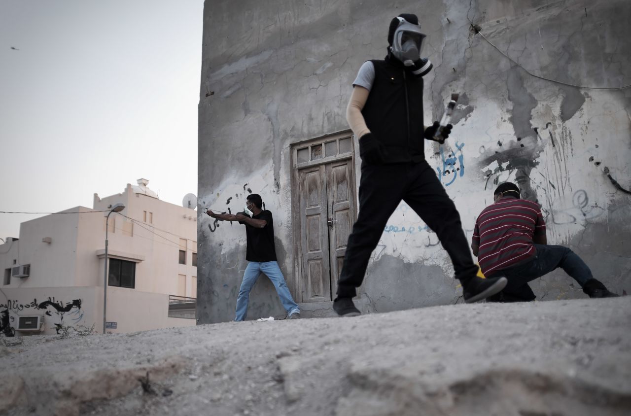 On Tuesday, April 22, Bahraini protesters clash with riot police after the funeral of Ahmed al-Mosajen and Ali Abbas, who died when their vehicle exploded two days earlier. <a href="http://www.cnn.com/2014/04/18/world/gallery/week-in-photos-0418/index.html">See last week in 33 photos.</a>