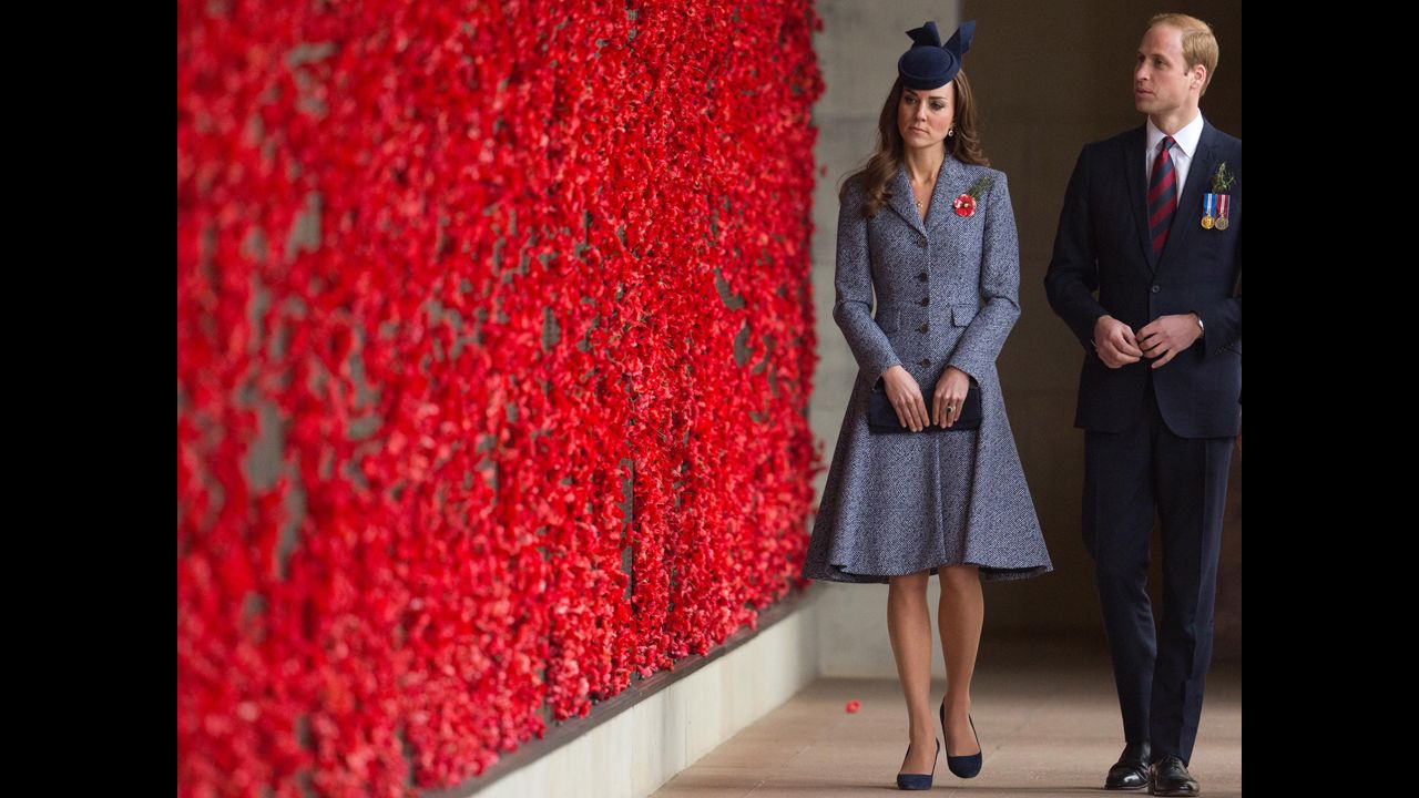 The royal couple walk along the World War I Wall of Remembrance during their visit to the Australian War Memorial.