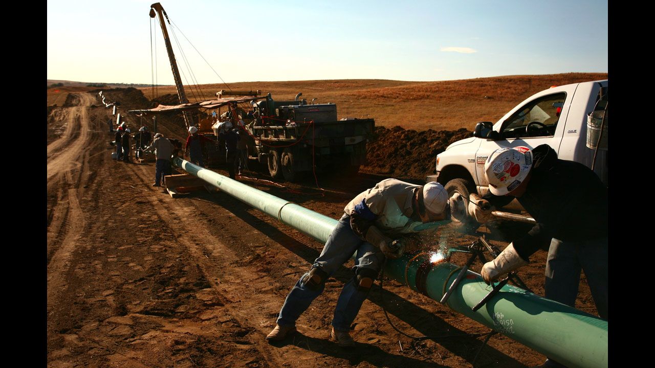 A crew constructs a 10-inch gas pipeline outside Watford City, North Dakota in October 2011. In fracking, water, sand and chemicals are injected under high pressure into a gas well.