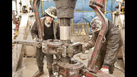 Rig workers drill a saltwater well to get fluids to be used in a fracking operation in Anthony, Kansas, in February 2012.