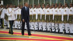 US President Barack Obama (C) inspects the Royal Malay Regiment Guard of Honour during his welcoming ceremony at parliament house in Kuala Lumpur on April 26, 2014. Obama arrived in Malaysia for a visit aimed at energising relations with the predominantly Muslim nation and re-focusing an Asian tour repeatedly distracted by foreign-policy crises elsewhere. AFP PHOTO / Jim WATSON (Photo credit should read JIM WATSON/AFP/Getty Images)
