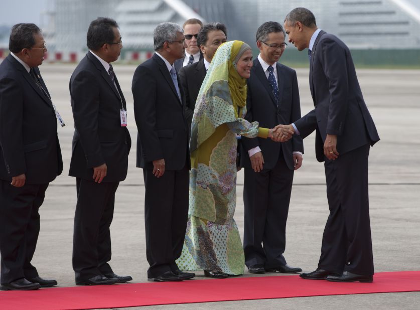Obama is greeted by Malaysian officials as he deplanes from Air Force One at the Royal Malaysian Air Force Airbase outside of Kuala Lumpur on Saturday, April 26.