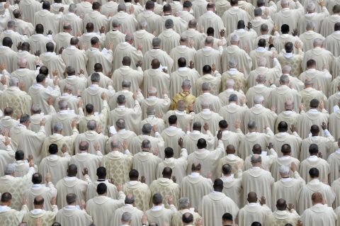 Priests attend the canonization Mass for Popes John XXIII and John Paul II at the Vatican on April 27.