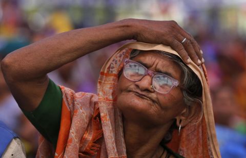 A supporter listens to Bahujan Samaj Party leader Mayawati during an election rally in Allahabad on Sunday, April 27.