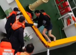 Sewol ferry captain Lee Joon-seok  being rescued in his shorts.