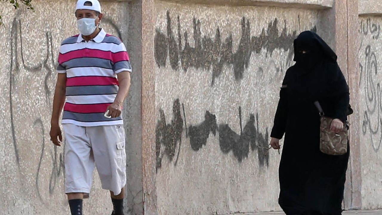 A Saudi man wears a mask as he walks in the city of Jeddah on April 27. Saudi Arabia has recently seen an alarming increase in confirmed cases of Middle East respiratory symptom coronavirus.