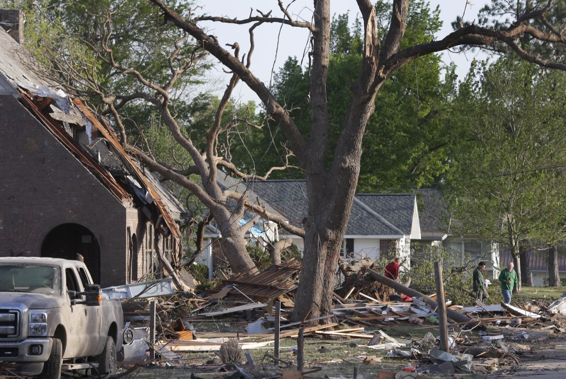 Residents of Baxter Springs, Kansas, view damage on April 28. A tornado estimated to be three blocks wide rumbled through Baxter Springs, said Cherokee County emergency manager Jason Allison.