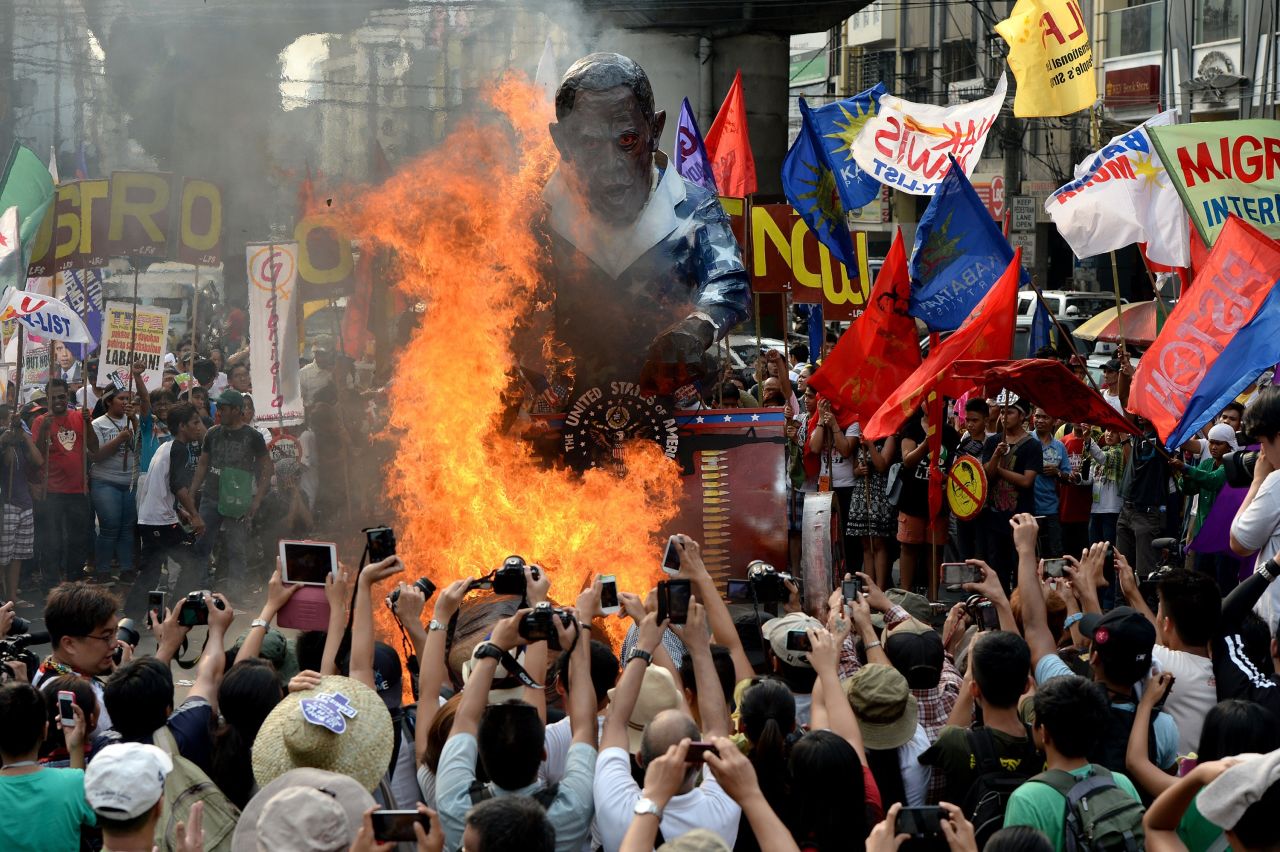 Protesters burn an effigy of Obama during an anti-U.S. protest near Malacanang Palace on April 28.
