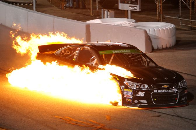 Reed Sorenson's car catches fire on Saturday, April 26, during the NASCAR Sprint Cup race in Richmond, Virginia. Sorenson was OK after being pulled from the car.