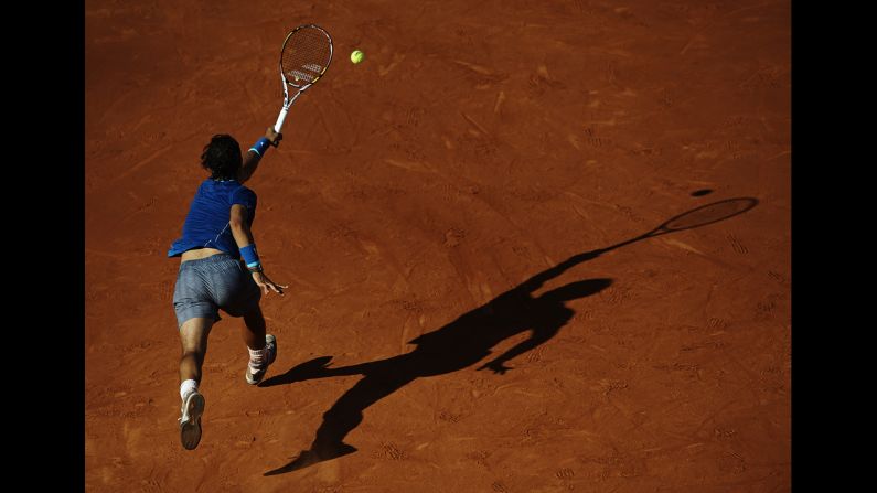 Rafael Nadal reaches for a shot on Friday, April 25, during a quarterfinal match at the Barcelona Open in Barcelona, Spain. Nicolas Almagro upset Nadal in three sets, ending Nadal's 41-match winning streak at the event.