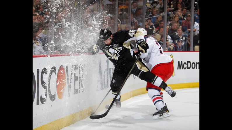 Pittsburgh's Joe Vitale, left, and Columbus' Ryan Murray collide behind the net on Saturday, April 26, during Game 5 of the teams' first-round NHL playoff series. Pittsburgh won the home game to take a 3-2 lead in the best-of-seven series.