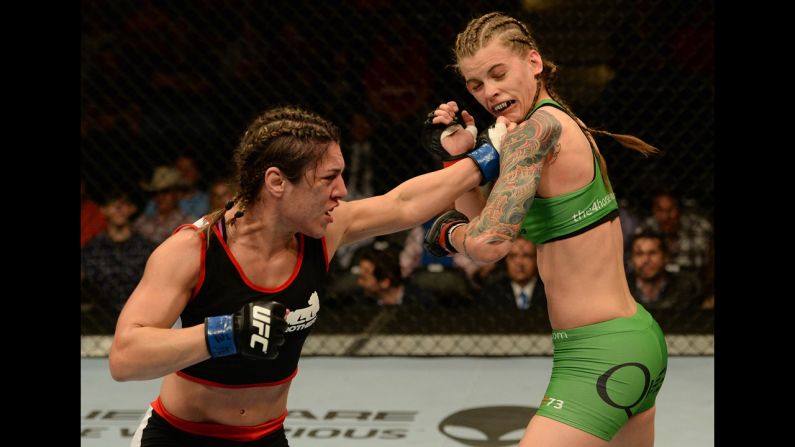 Bethe Correia punches Jessamyn Duke during UFC 172, which took place Saturday, April 26, in Baltimore. Correia won the bout by unanimous decision.