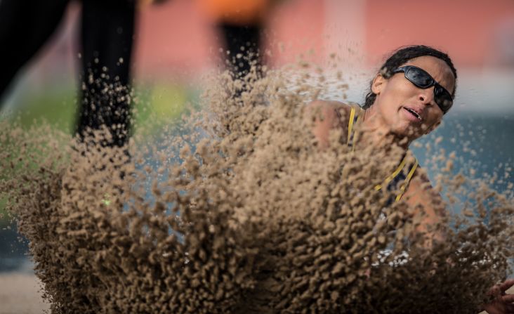 Silvania Costa de Oliveira, a paralympic athlete from Brazil, competes in the long jump during the T11 event at the Loterias Caixa Brazilian Athletics Open Championships on Friday, April 25. The T11 category is for athletes who are visually impaired.