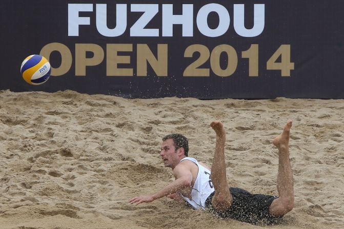 Beach volleyball player Jan Dumek dives to the ground during a match Wednesday, April 23, at the Fuzhou Open in Fuzhou, China.