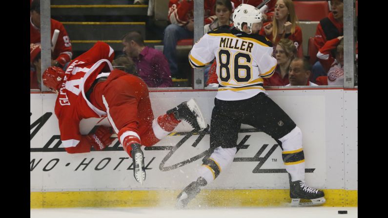 Detroit's Luke Glendening battles for the puck with Boston's Kevan Miller in Game 3 of the teams' first-round NHL playoff series on Tuesday, April 22. Boston, the defending Eastern Conference champions, won the game and later the series.