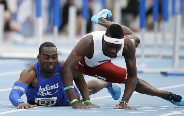 Indiana State's Greggmar Swift collides with Arkansas' Omar McLeod at the finish line of the 110-meter hurdles Saturday, April 26, at the Drake Relays meet in Des Moines, Iowa. Swift finished in second and McLeod finished in third.