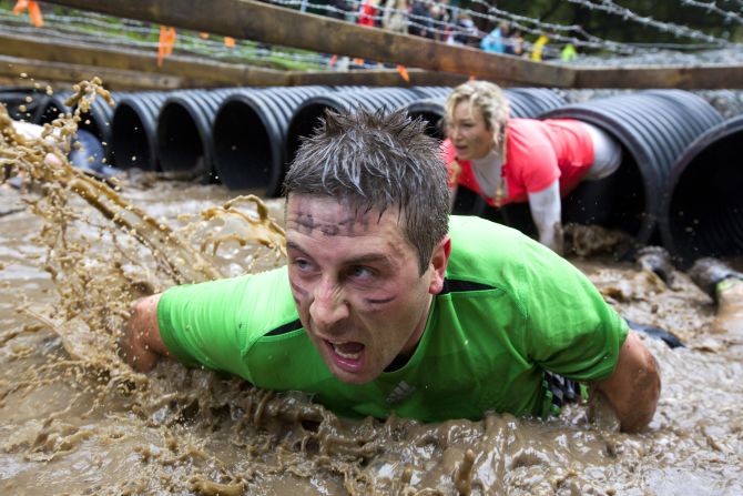 Participants crawl through tubing during the Tough Mudder endurance race held Saturday, April 26, in Henley-on-Thames, England. <a href="index.php?page=&url=http%3A%2F%2Fwww.cnn.com%2F2014%2F04%2F22%2Fworldsport%2Fgallery%2Fwhat-a-shot-0422%2Findex.html">See 25 amazing sports photos from last week</a>