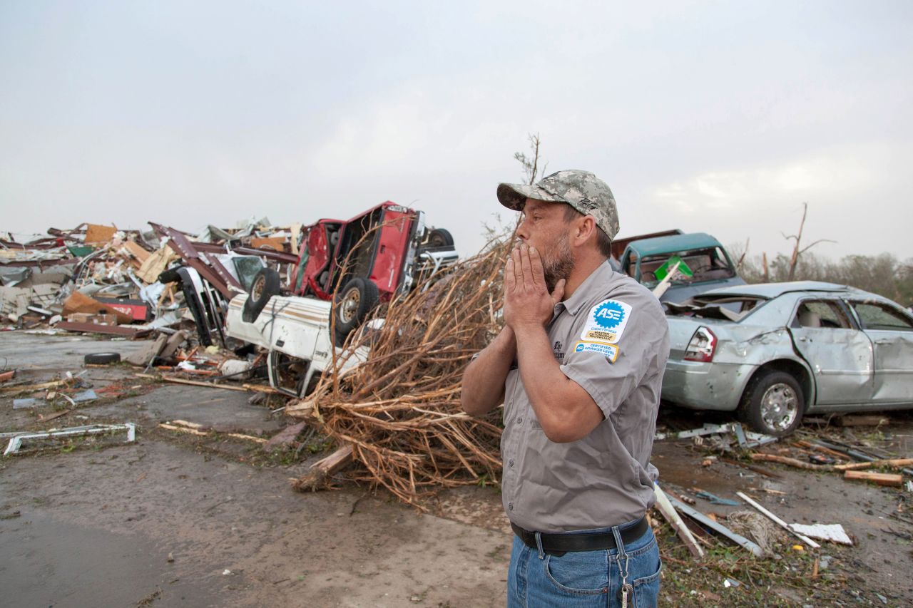 John Smith reacts after seeing what's left of his auto repair shop in Mayflower, Arkansas, on April 28.
