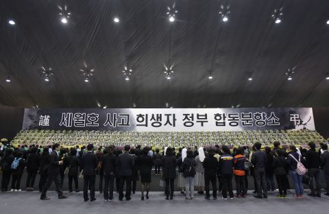 People pay tribute to victims at a memorial altar in Ansan, South Korea, on Tuesday, April 29.