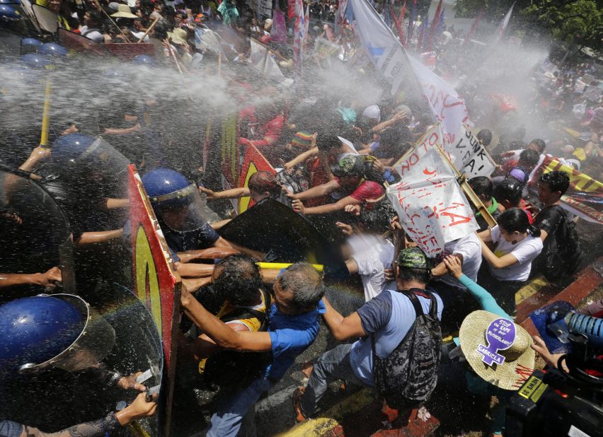 Filipinos protesting Obama's visit are dispersed by water cannon near the U.S. embassy in Manila on April 29.