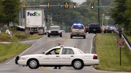 Image #: 29024542    epa04185050 Law enforcement officers respond to a workplace shooting at a FedEx facility in Kennesaw, Georgia, USA, 27 April 2014. At least six people have been shot in the incident according to the the Cobb County Police.  EPA/ERIK S. LESSER /LANDOV