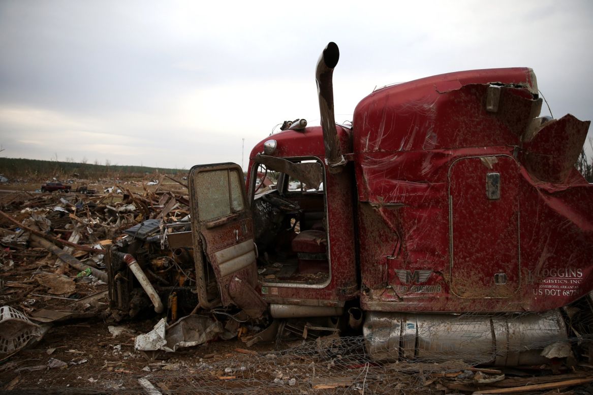 The remains of a large truck rest amid debris in Vilonia on April 29.