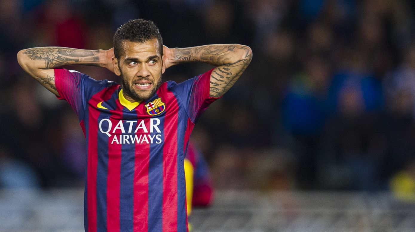 Dani Alves responded by picking up a banana and eating it after finding himself the target of racial abuse during Barcelona's 3-2 win at Villarreal Sunday.