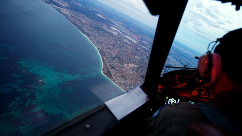  Crew onboard an RAAF AP-3C Orion crosses the coast of Perth, having just completed an 11 hour search mission for missing Malaysia Airways Flight MH370, before landing at RAAF Pearce airbase on March 24, 2014 in Perth, Australia.