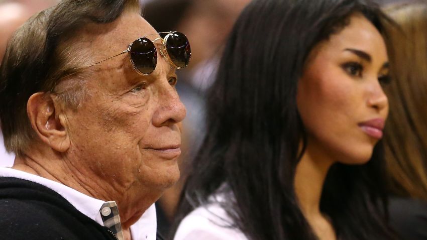 SAN ANTONIO, TX - MAY 19: (2nd L) Team owner Donald Sterling of the Los Angeles Clippers and V. Stiviano watch the San Antonio Spurs play against the Memphis Grizzlies during Game One of the Western Conference Finals of the 2013 NBA Playoffs at AT&T Center on May 19, 2013 in San Antonio, Texas. NOTE TO USER: User expressly acknowledges and agrees that, by downloading and or using this photograph, User is consenting to the terms and conditions of the Getty Images License Agreement. (Photo by Ronald Martinez/Getty Images)
