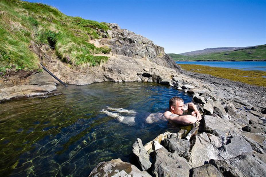 At Hellulaug hot spring the water is warm enough to soak in on a winter day but easier to deal with than some Icelandic geothermal pools that simmer above 40 C.
